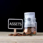 Assets and a cup of money Assets and a cup of money